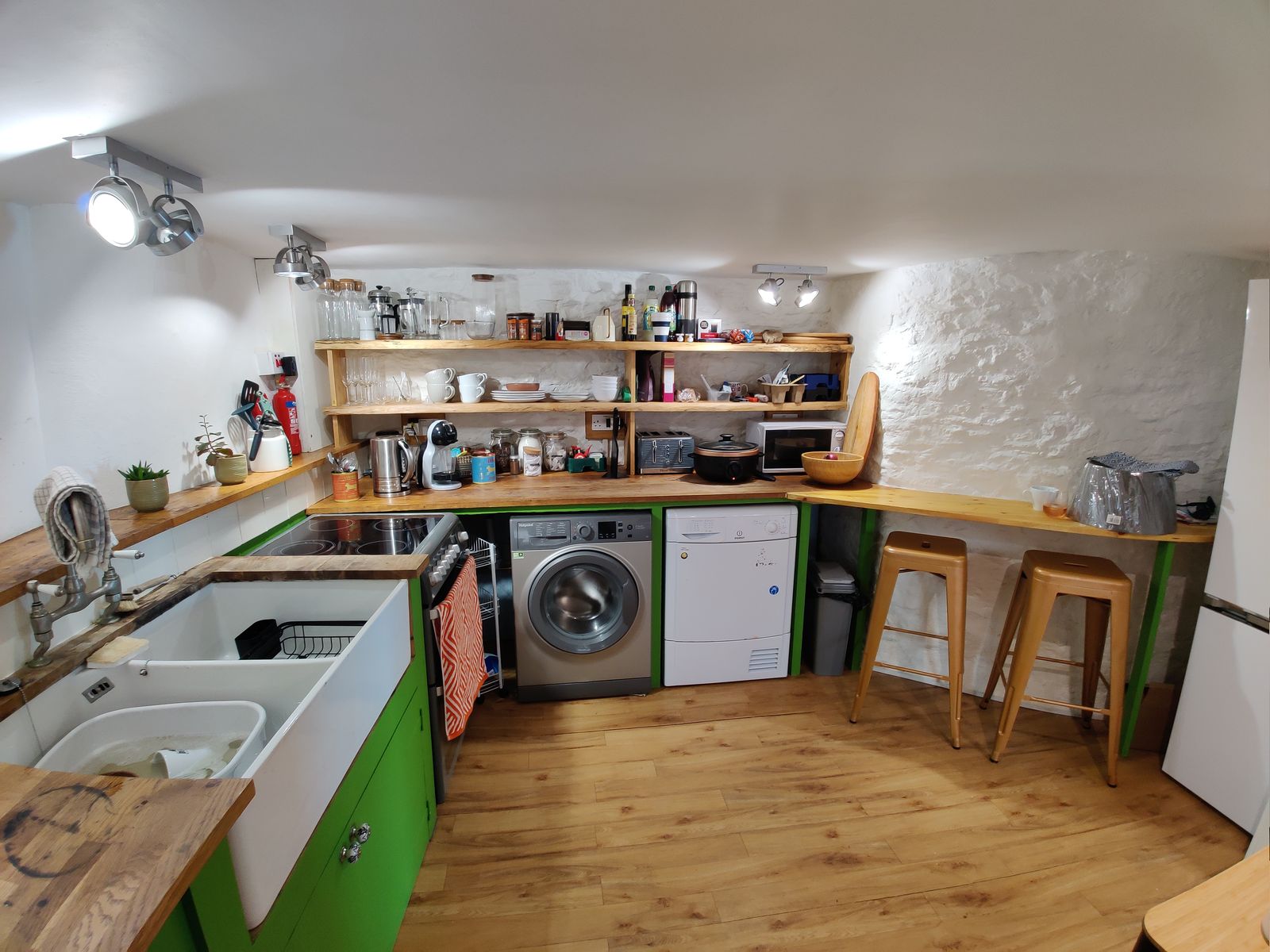 The kitchen with a Belfast sink and breakfast bar