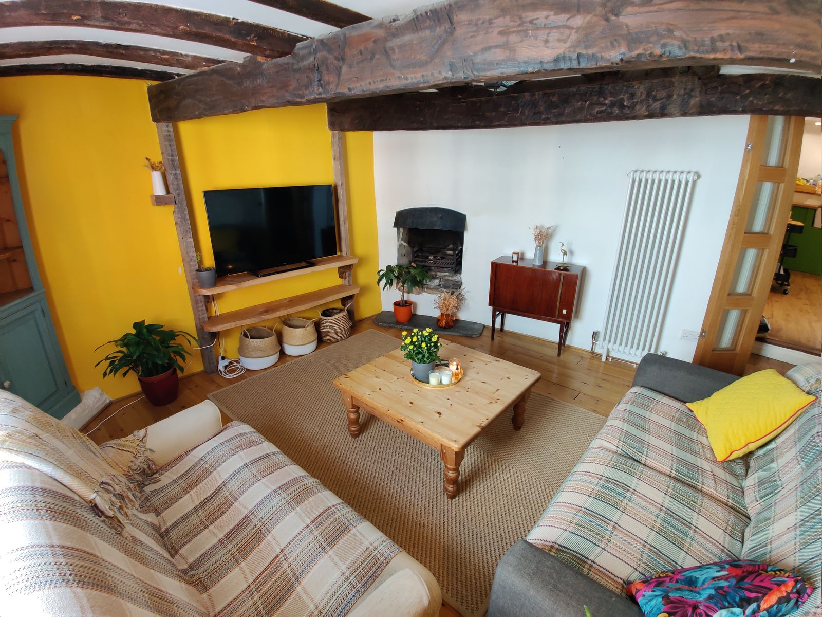 The living room with its wood-burning fireplace