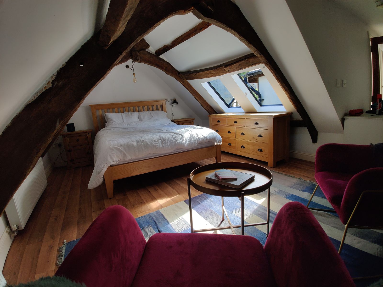 The master bedroom in the beamed loft